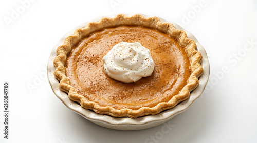 Traditional American pumpkin pie with smooth creamy orange filling, delicate pastry crust, cinnamon dusting and a small dollop of whipped cream, isolated on pure white background