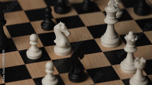 chess on a wooden board going around in circle