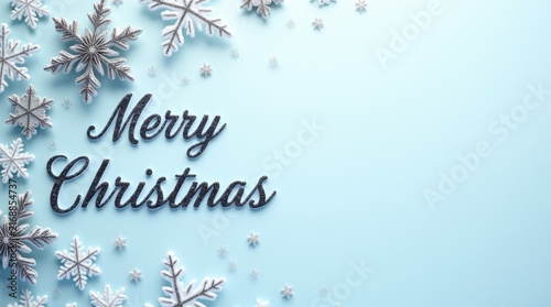 Merry Christmas greeting with snowflakes on a light blue background  