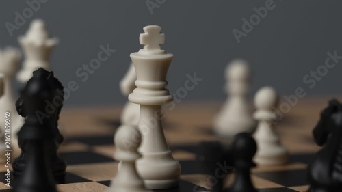 chess on a wooden board going around in circle