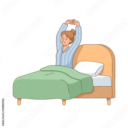 Young woman stretching arms above head in bed  