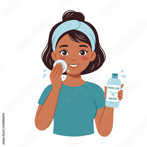 Young woman cleaning her face with micellar water in a bright setting  