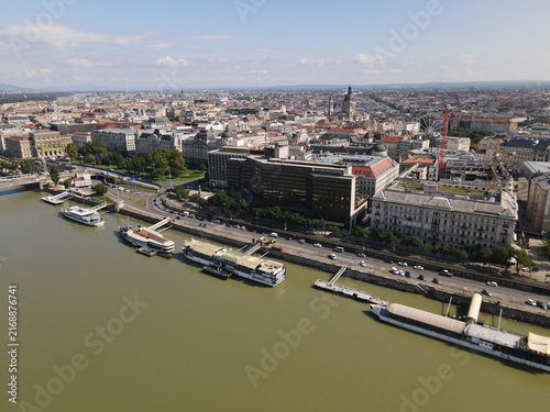 Aerial View of the Danube River with Ships and Budapest Cityscape on a Sunny Day