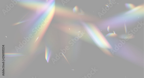 Fotografie Colorful light refractions scatter in varying directions across a dark background