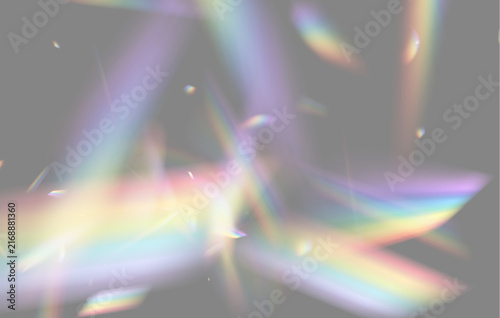 Intersecting beams of refracted light create vivid rainbow patterns on a black background. Soft, blurry streaks and sharp color fragments blend with a glowing iridescent effect.