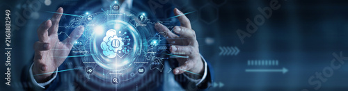 Smart manufacturing. Systems specialist holding glowing Industry 4.0 automation over a global network on an abstract dark background. Industrial IoT and robotics.