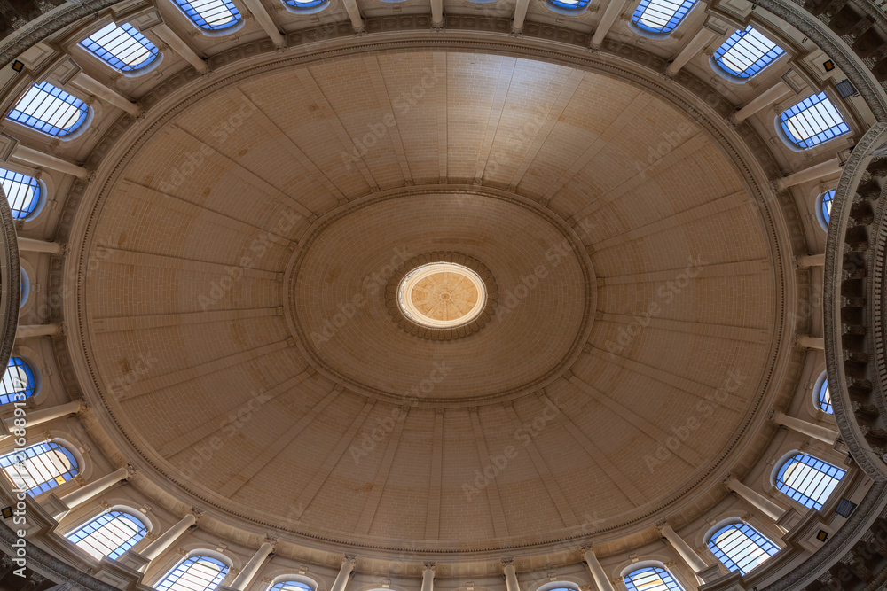 Obraz premium Grand symmetrical dome interior showcasing a central skylight, surrounding arched windows and classical columns in a historic rotunda. Basilica of Our Lady of Mount Carmel, Valletta, Malta