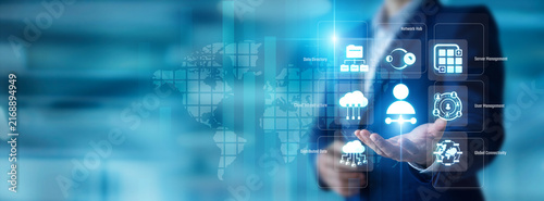 Systems engineer holding a routing cord in hand. Network Admin maintains global enterprise connectivity and server health. Dedicated infrastructure support optimizes online traffic.