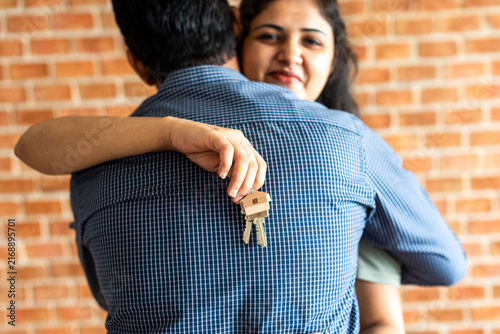Photography Couple celebrating new home keys