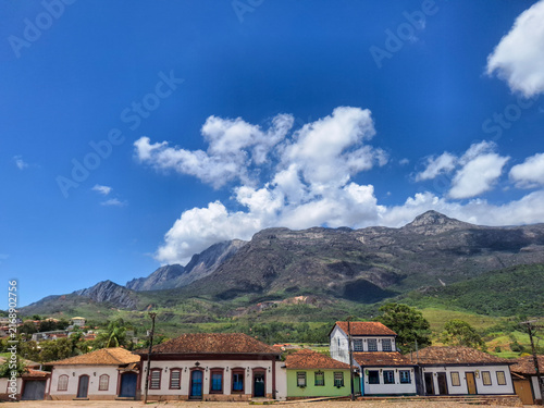Colorful Colonial Houses Beneath a Majestic Mountain Range