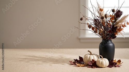 Autumn arrangement with pumpkins, dried flowers, and leaves, halloween concept, copy space