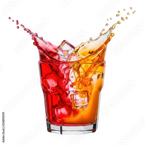 Red and orange cocktail splash with ice cubes in a glass isolated on white background