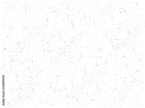 Fine grunge texture of scattered dust, grain and distressed speckles across a white background. Subtle vector overlay for weathered print effects, vintage surfaces and aged graphic designs.