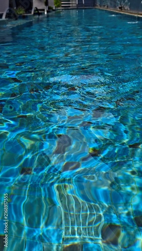 Ripples on the surface of a blue swimming pool