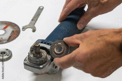 Technician Disassembling an Angle Grinder for Repair and Maintenance