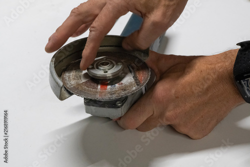 Technician Disassembling an Angle Grinder for Repair and Maintenance