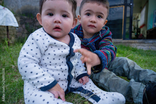 Close portrait of young brothers sharing a moment outdoors in rural Mexico.