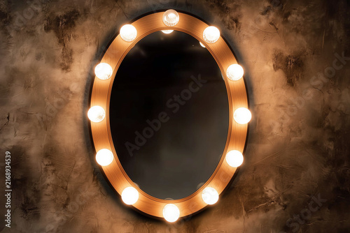 Hollywood mirror. Vanity mirror with lights. Lighted makeup mirror. Theater dressing room mirror.
Broadway-style vanity mirror. Background 