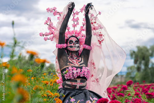 Catrina with Upraised Arms Among Marigolds