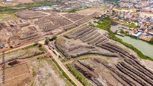 Canvastavla Rows of drying waste and compost windrows at an open waste segregation site