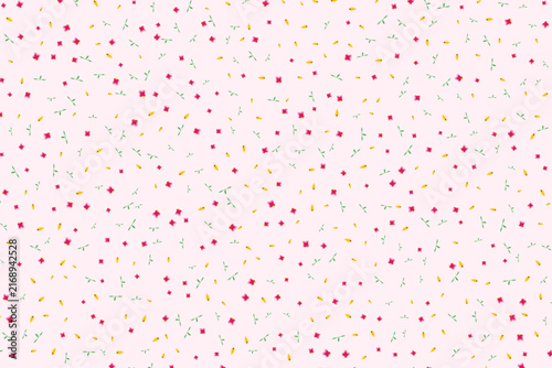 Seamless pattern with small pink flowers and yellow petals on a light pink background for textile design
