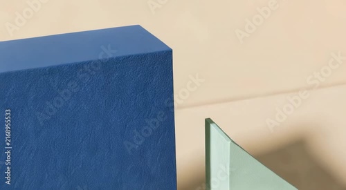 Minimal still life arrangement of pastel geometric shapes on a beige background, featuring stacked cubes, rectangles, semicircle, circle, triangle and stepped platform
