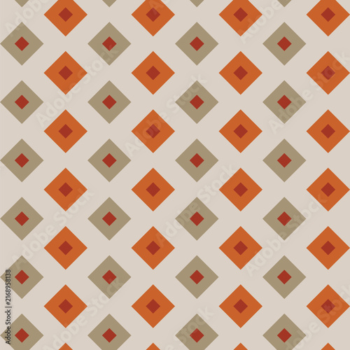 Seamless pattern created from small brown  diamonds in larger khaki and orange diamonds on a pale grey background