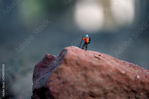 Hiker conquering a challenging rock formation