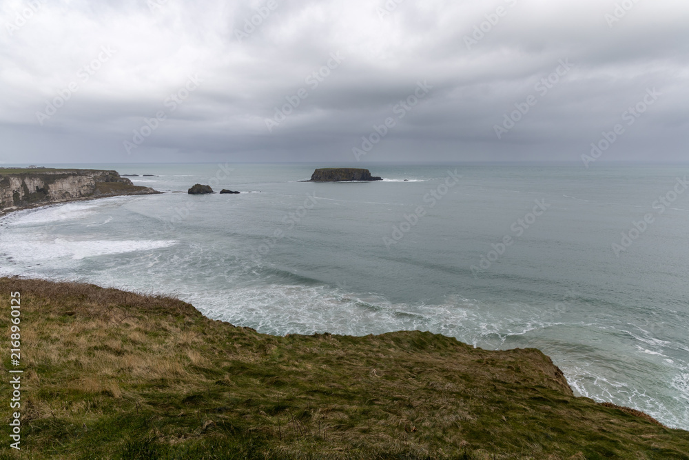 Fototapeta premium Scenic coastal landscape near Carrick-a-Rede Rope Bridge on the famous Causeway Coast Route in County Antrim, Northern Ireland