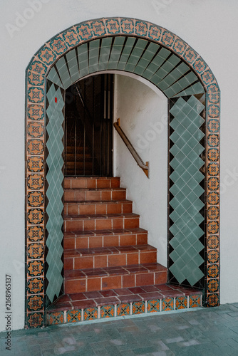 Konstfotografi Colorful tiled entrance to a front door located at the top of a staircase