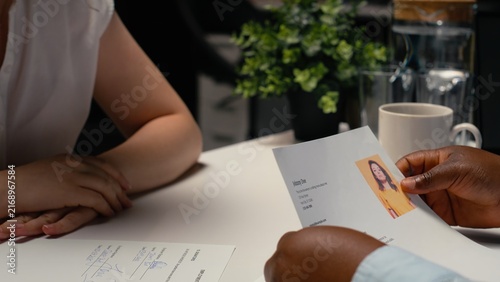 Konstfotografi Job seeker signs a work contract after a successful interview while reviewing legal employment terms and completing the onboarding process