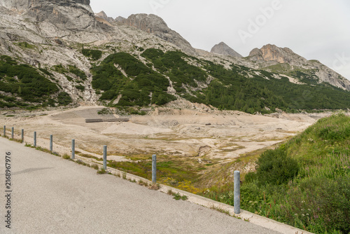 Canazei, Italy. Lago di Fedaia reservoir with extensive exposed lakebed during drought and low water levels