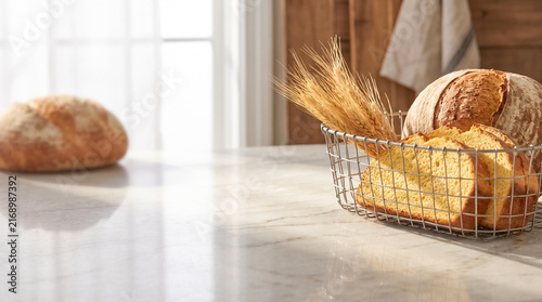 Freshly Baked Bread in a Basket: A rustic basket holds crusty loaves and sliced bread, alongside ears of wheat, suggesting homemade goodness and artisanal quality in a cozy kitchen setting.