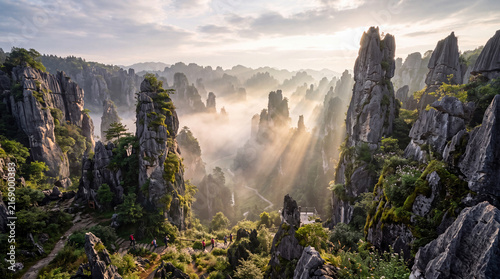 AI-generated illustration of a majestic stone forest with towering limestone pillars and hikers on a mountain trail under beautiful morning sunbeams.