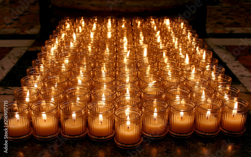 Sunday candles lit in church