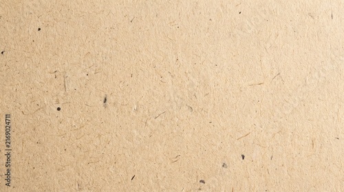 Beige paper texture background. Smooth surface of recycled cardboard with natural flecks. Vintage craft material for letter writing, document backdrop and creative graphic design