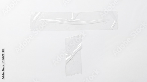 Two pieces of clear adhesive tape strips