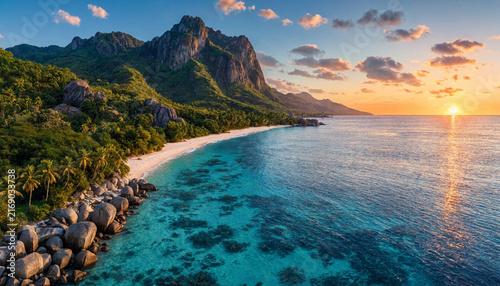 Sunset Landscape of a Tropical Beach with Rocky Outcrops and Palms
