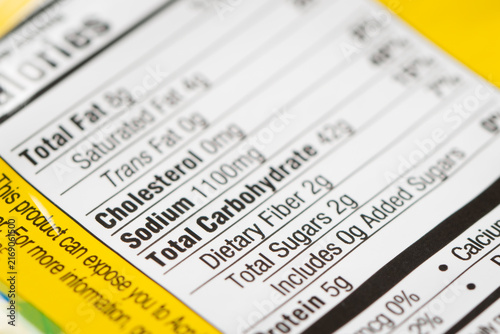 Nutrition facts label on a packaged instant noodle ramen, highlighting high sodium content.