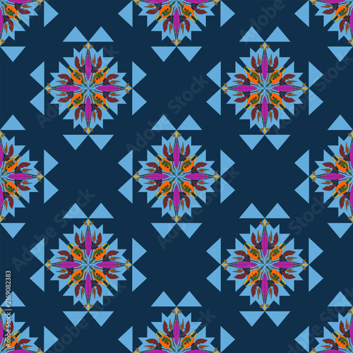 Exquisite fabric design featuring deep dark blue background with bright blue triangles and colorful orange magenta brown floral elements perfect for fashion apparel and holiday textile decoration