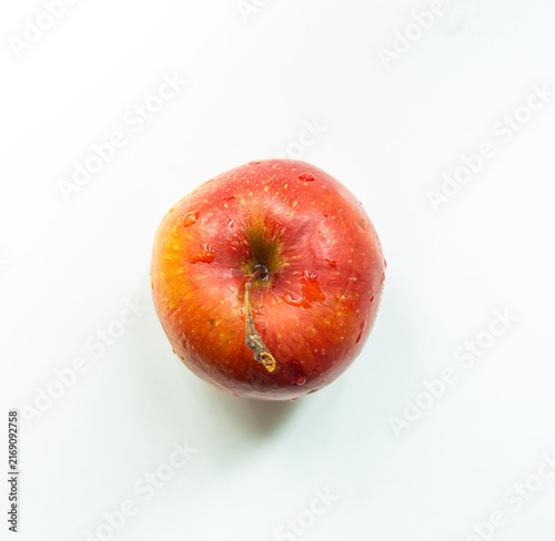 Ripe red apple top-down perspective on pure white surface