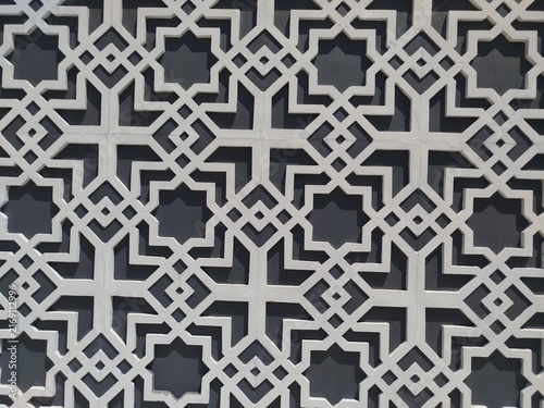 Intricate geometric Islamic pattern with symmetrical star motifs