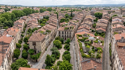 Aerial View of a Compact European Village Surrounded by Trees