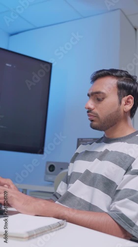 Software engineer wearing casual clothing typing on keyboard desktop computer information AI, management cybersecurity or coding software development. Programmer adult working artificial intelligence