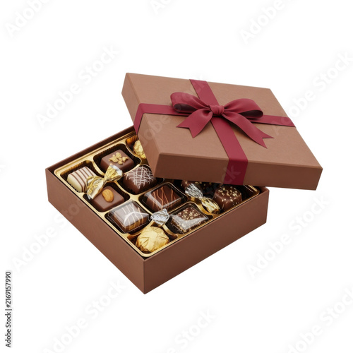 Luxury gourmet chocolate assortment in elegant brown gift box with festive red ribbon