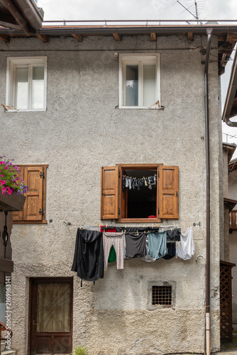 Alleghe, Italy. Household laundry air drying outside a traditional alpine house in the Dolomites