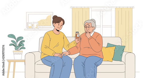 Caregiver assisting elderly woman with medication on sofa
