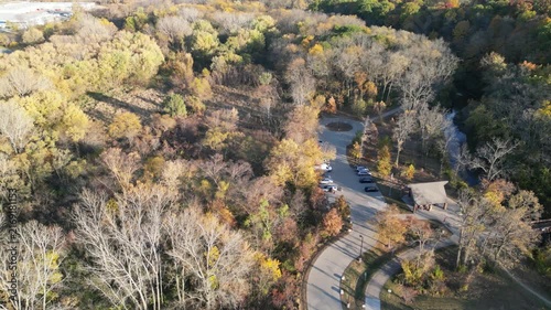 A park by a creek in the fall from above with a drone in Coralville, Iowa. 4k, drone, flying