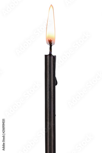 Memorial Days. A single burning black candle.