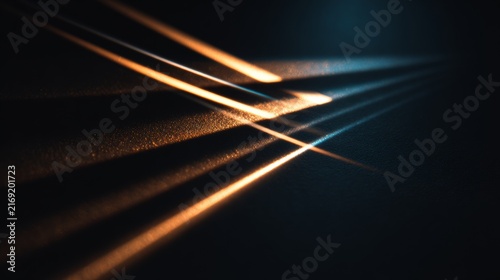 Light beams dance on a dark surface in an indoor setting during evening hours